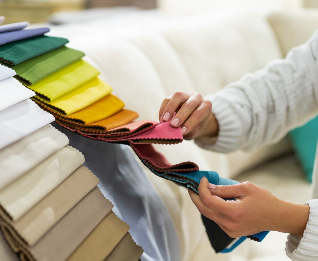 the-woman-chooses-the-fabric-on-the-sofa-textile-industry-background-tissue-catalog.jpg the-woman-chooses-the-fabric-on-the-sofa-textile-industry-background-tissue-catalog.jpg
